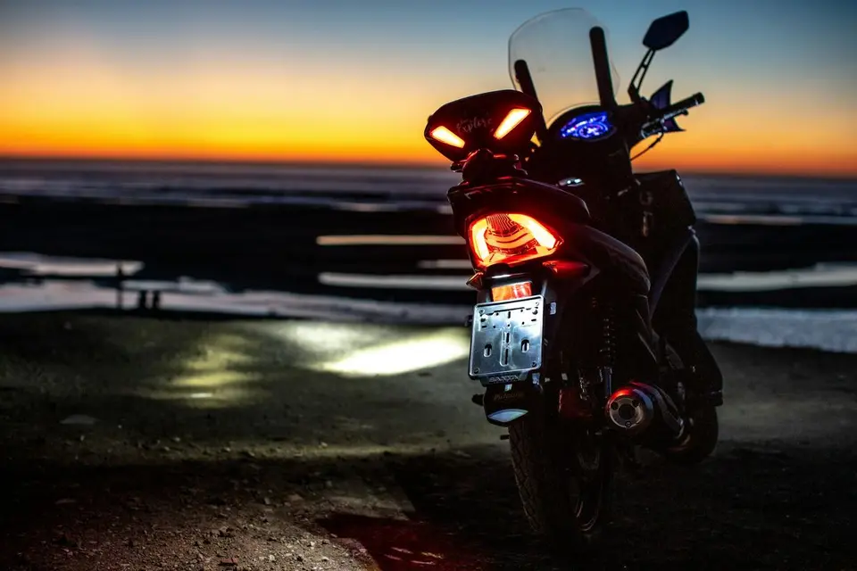 A motorbike parked by the sea, in Tangier