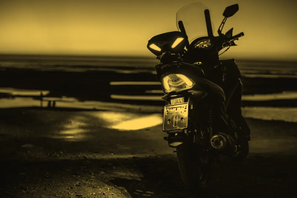 A motorbike parked by the sea in Tangier